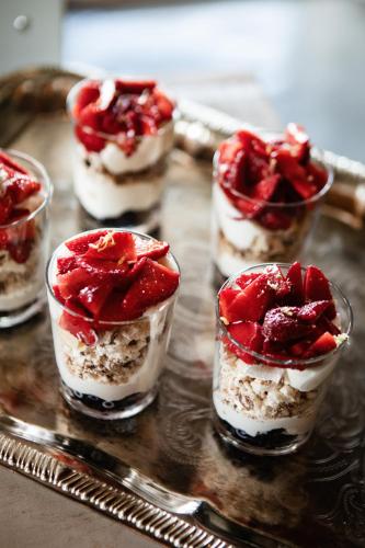 a tray with four desserts in small glass cups at Upperud 9:9 in Åsensbruk