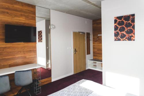 TV a/nebo společenská místnost v ubytování Hotel 107