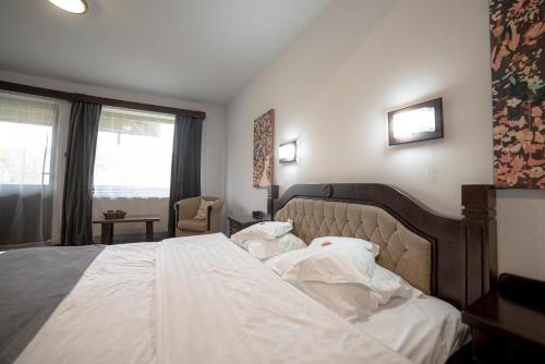 Ένα ή περισσότερα κρεβάτια σε δωμάτιο στο Bran Chalet