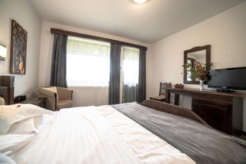 Ένα ή περισσότερα κρεβάτια σε δωμάτιο στο Bran Chalet
