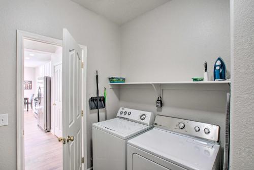 a white laundry room with a washer and dryer at Game Room and Pool Spacious Queen Creek Home! in Queen Creek