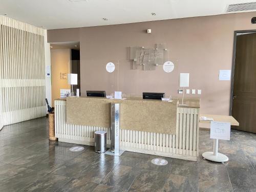 a lobby with a counter in a room at Holiday Inn Express Yopal by IHG in Yopal
