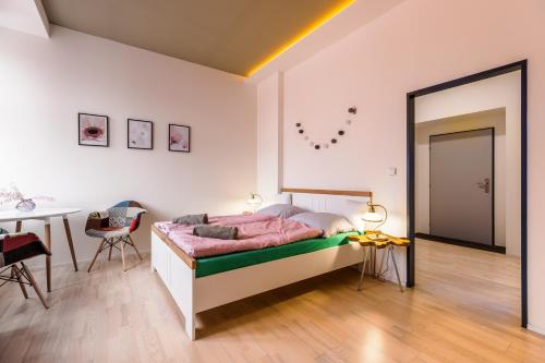 Postel nebo postele na pokoji v ubytování Design apartments Brno-center