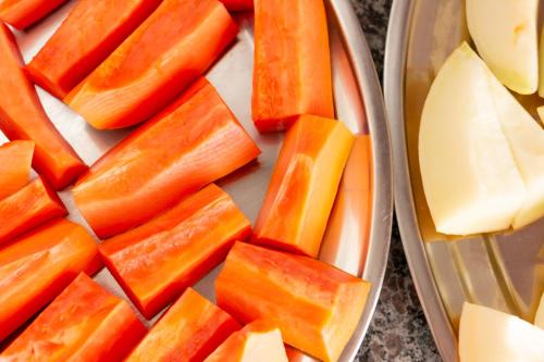 a tray of carrots and cheese and a plate of apples at Contagem Centro Hotel in Contagem