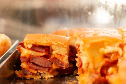 a close up of a piece of food on a plate at Contagem Centro Hotel in Contagem