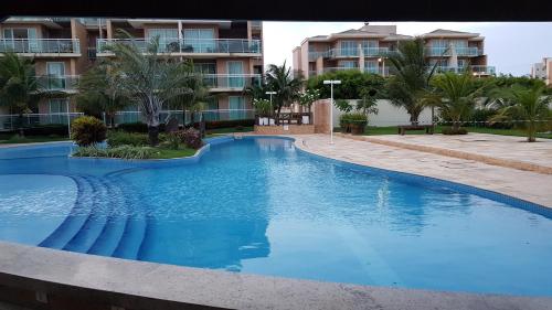 Bazén v ubytování PALM BEACH Porto das Dunas, apartamento todo climatizado TÉRREO a 350 metros Beach Park nebo v jeho okolí