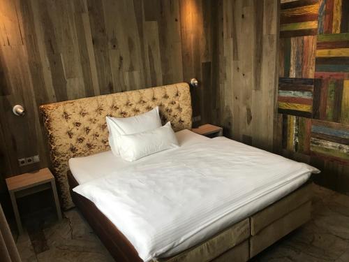 Ένα ή περισσότερα κρεβάτια σε δωμάτιο στο Hotel Fohlenhof