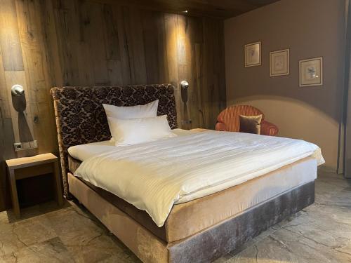 Ένα ή περισσότερα κρεβάτια σε δωμάτιο στο Hotel Fohlenhof