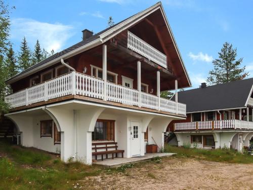 a large house with a gambrel roof at Holiday Home Iso kiiruna by Interhome in Hyrynsalmi