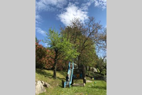 a person sitting on a slide in a park at TRADITIONAL VILLA BELLAGIO san primo LAKE COMO in Bellagio