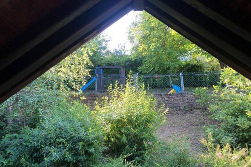 an attic view of a garden with a playground at TRADITIONAL VILLA BELLAGIO san primo LAKE COMO in Bellagio