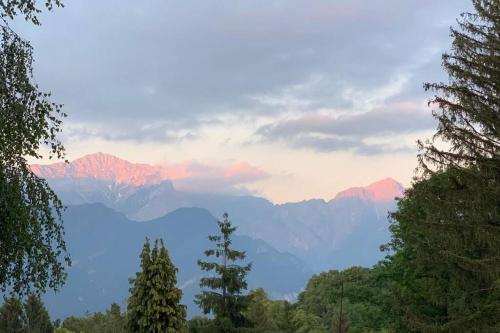 a view of a mountain range with trees in the foreground at TRADITIONAL VILLA BELLAGIO san primo LAKE COMO in Bellagio