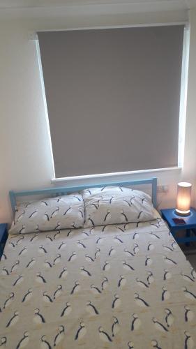 Ένα ή περισσότερα κρεβάτια σε δωμάτιο στο Chalet Bayside