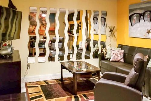 a living room with a couch and a table at 1 Block to Shore Family Condo in Myrtle Beach! in Myrtle Beach