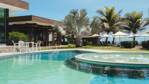 uma piscina em frente a um resort em Kembali Hotel Porto de Galinhas - Adults Only em Porto de Galinhas