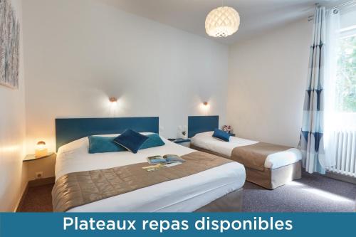 Ένα ή περισσότερα κρεβάτια σε δωμάτιο στο Hotel De La Pommeraie