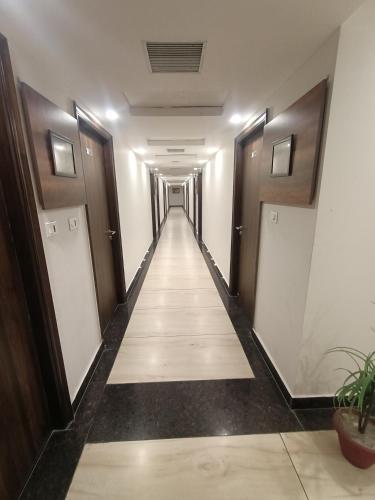 a corridor of a hallway with a long aisle at Clarks Inn Express, Jammu in Jammu
