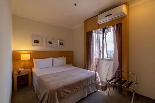 Cama o camas de una habitación en Vivapp Aeroporto Congonhas E-suites Residencial