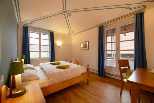 Ένα ή περισσότερα κρεβάτια σε δωμάτιο στο LindenGut Bio Hotel & Bio Herberge