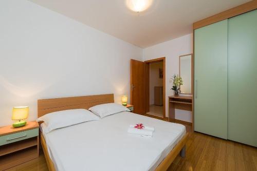 Postelja oz. postelje v sobi nastanitve Apartment in Bol with balcony, air conditioning, Wi-Fi, washing machine (156-7)