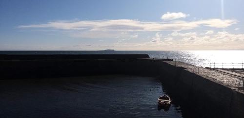 a small boat in a canal in the water at New Holliday Villa, Anstruther in Cellardyke