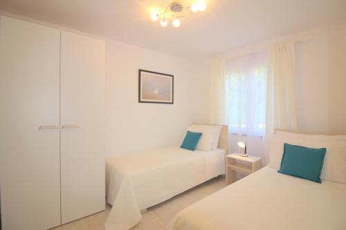 Postel nebo postele na pokoji v ubytování Bungalow Porec (4400-4)