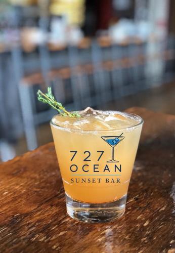 a drink in a glass sitting on a table at Smuggler's Cove Inn in Boothbay