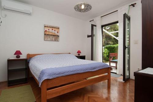 Posteľ alebo postele v izbe v ubytovaní Guesthouse Losinj (4241)