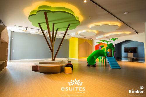 a childrens room with a play area with a playground at Grand Suítes Family Resort by Atlantica in Itá