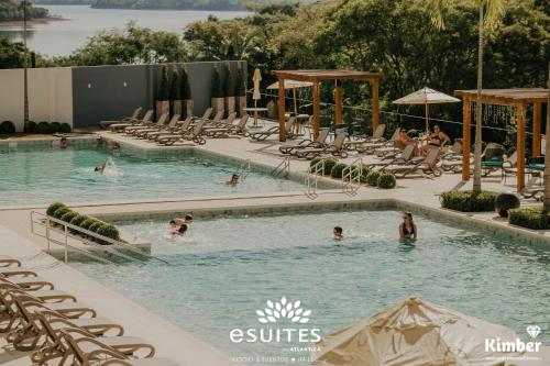 a group of people in a swimming pool at Grand Suítes Family Resort by Atlantica in Itá