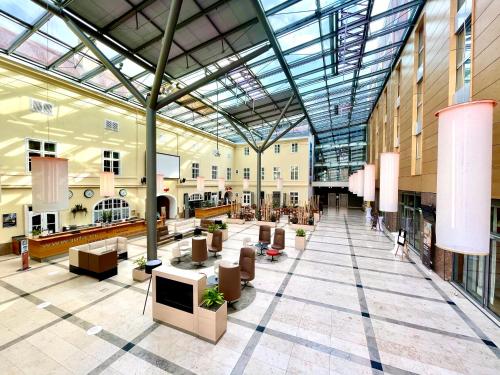 a large building with a glass ceiling and a lobby at JUFA Hotel Wien in Vienna
