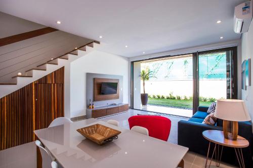 a living room with a white table and a couch at Residencial Marina Del Sol in Pauba