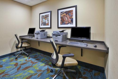an office with a desk with a computer and two chairs at Candlewood Suites Morgantown-Univ West Virginia by IHG in Morgantown