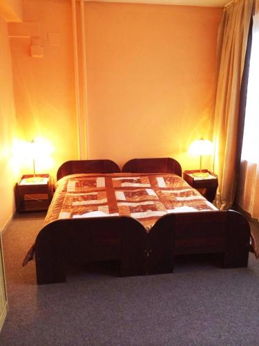 Postel nebo postele na pokoji v ubytování Hotel Uno