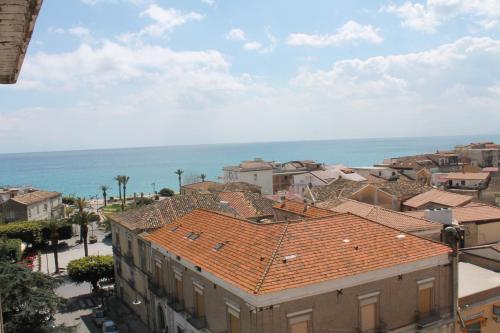 a view of a city with buildings and the ocean at Hotel Mediterraneo in Roccella Ionica