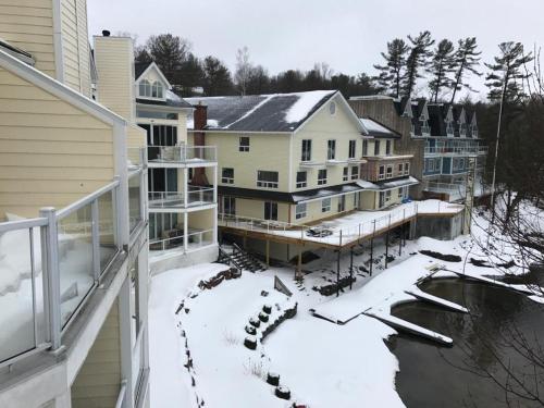 a group of houses with snow on the ground at Muskoka Lakes Hotel and Resorts in Port Carling