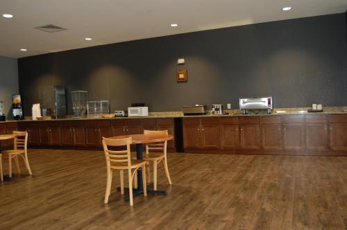 a waiting room with tables and chairs and a counter at Vacation Lodge in Pigeon Forge