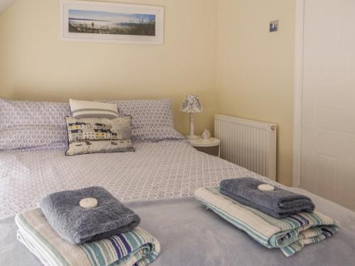 Posteľ alebo postele v izbe v ubytovaní Cobble Cottage