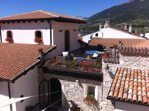 an overhead view of a building with flowers on the balconies at Il Lavatoio Dimora Storica in Castel di Sangro