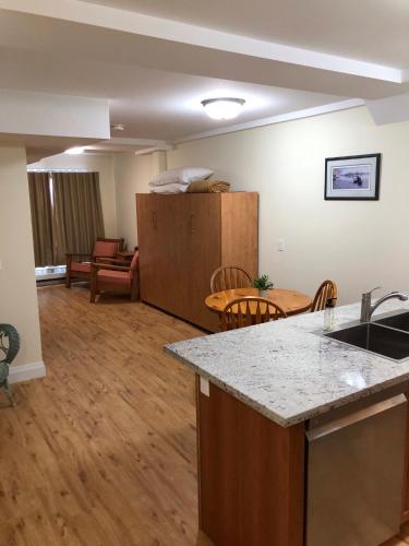 an empty living room with a kitchen and a dining room at Muskoka Lakes Hotel and Resorts in Port Carling