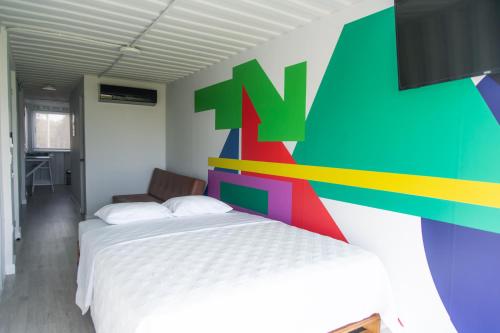 Cama o camas de una habitación en Nomada Republic Hotel Punta Chame