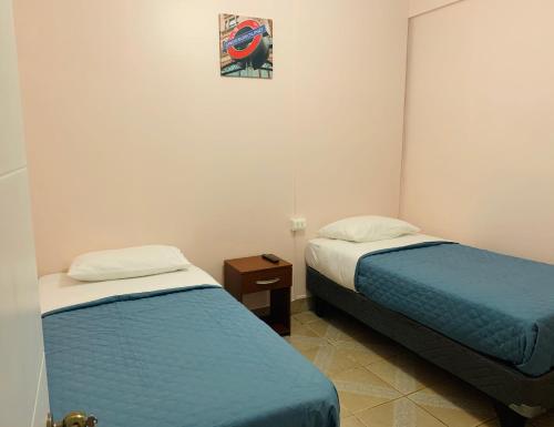 Hostal Iria tesisinde bir odada yatak veya yataklar