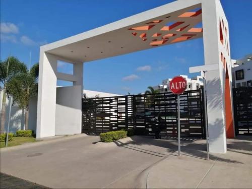 a stop sign in front of a gas station at Departamento para familias in Mazatlán