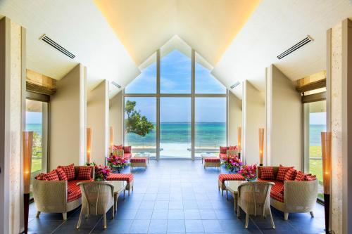 a lobby with a view of the ocean at Beach Hotel Sunshine in Ishigaki Island