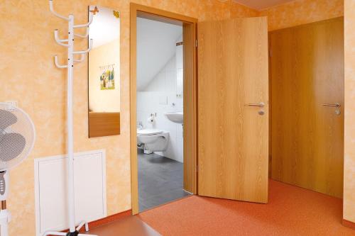 an open door to a bathroom with a toilet at Private Ferienwohnungen in Fürth bei Nürnberg in Fürth