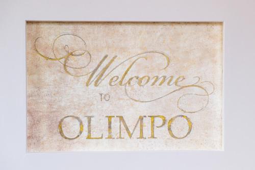 a sign with the words welcome to ombro at Olimpo B&B in Giurdignano