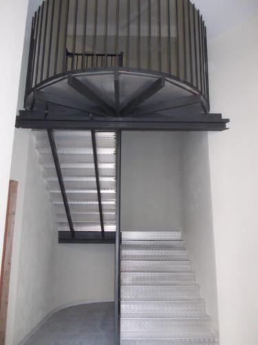 a staircase in a building with a metal structure at Loft Regio Parco in Turin
