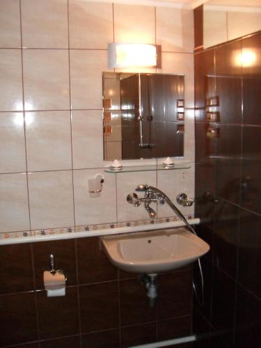 a bathroom with a sink and a mirror at Borimechkova Kashta in Koprivshtitsa