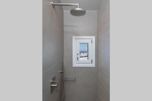 Koupelna v ubytování Luxury Apartment in the Heart of Astypalaia