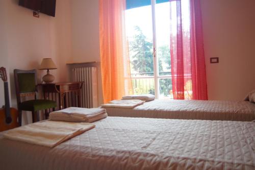 Posteľ alebo postele v izbe v ubytovaní B&B Bibliotechina